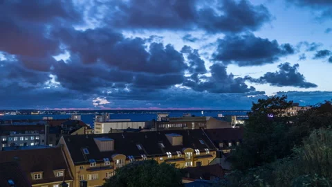 Dramatic Clouds Over Helsingborg Rooftops at Twilight Stock Footage 344014124