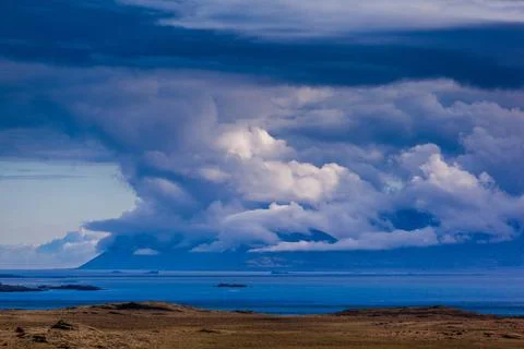 Dramatic clouds over Iceland dramatically shaped clouds over a fjord on Ic... Stock Photos