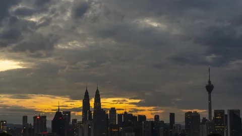 Dramatic clouds over Kuala Lumpur city center during sunrise view from far Stock Footage 101408357