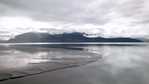 Dramatic clouds over a majestic mountain landscape in Alaska near Turnagain arm. Video stock 333602397