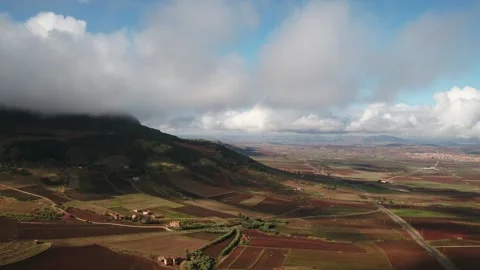 Dramatic Clouds Over Middle Atlas Farmland and Mountain Valley, Morocco Stock Footage 332475877