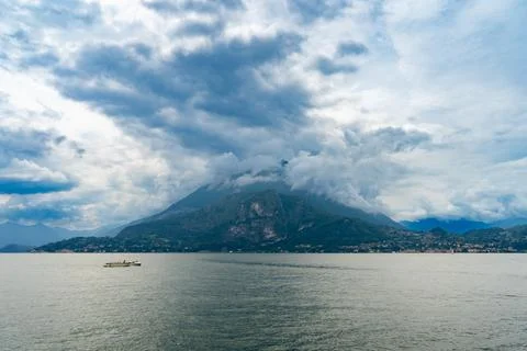 Dramatic Clouds Over Mountain and Lake Stock Photos