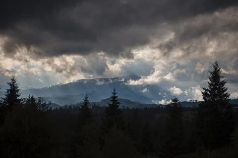 Dramatic Clouds Over Mountain Landscape Stock Photos