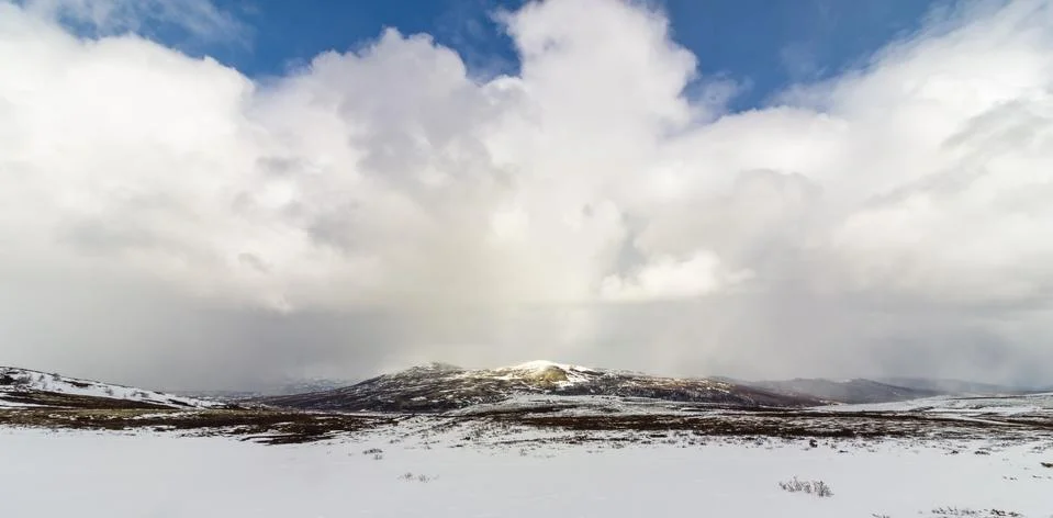 Dramatic clouds over the mountains in the Dovre mountains in Norway Stock Photos