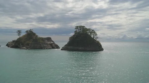 Dramatic clouds over sea stacks in the sea in Izu Peninsula, Shizuoka Stock Footage 194407713