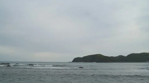 Dramatic clouds over sea stacks in the sea in Izu Peninsula, Shizuoka Stock Footage 194407862