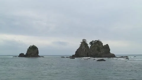 Dramatic clouds over sea stacks in the sea in Izu Peninsula, Shizuoka Stock Footage 194407867