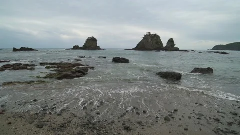 Dramatic clouds over sea stacks in the sea in Izu Peninsula, Shizuoka Stock Footage 194407879