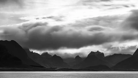 Dramatic clouds over sharp peaks Stock Footage 250436956
