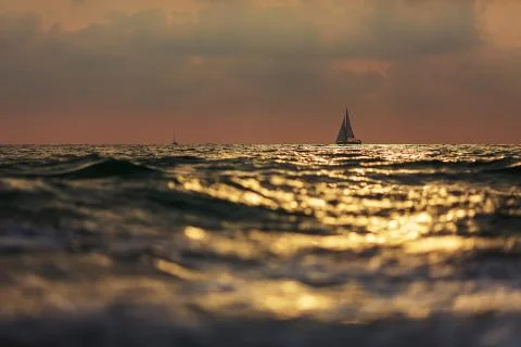 Dramatic clouds over stormy sea and lonely yacht Foto stock