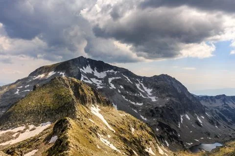 Dramatic clouds over the summits at pirin mountain in Bulgaria. Stock Photos