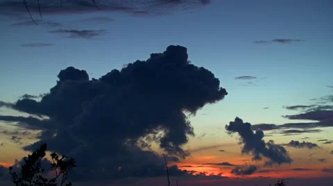 Dramatic clouds over sunset time lapse Stockbeeldmateriaal 49958464