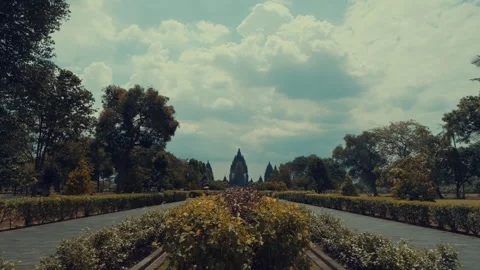Dramatic Clouds Over Temple Park Walkway and Greenery Stock Footage 333326030