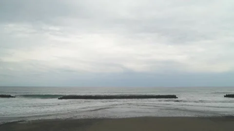 Dramatic clouds over tetrapods in the sea in Kawazu, Shizuoka Prefecture, Japan Stock Footage 194407810