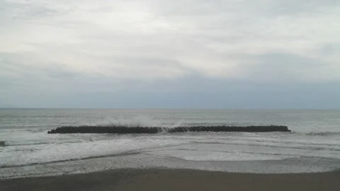 Dramatic clouds over tetrapods in the sea in Kawazu, Shizuoka Prefecture, Japan Stock Footage 194407865