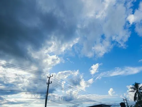Dramatic Clouds Over Utility Poles Stock Photos