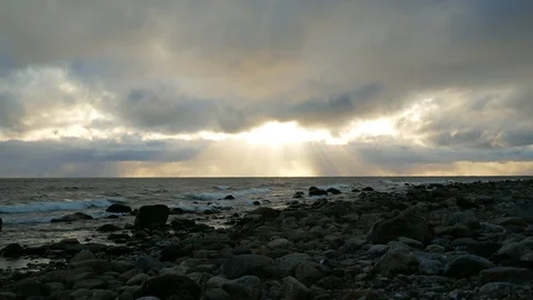 Dramatic clouds with rays of light at the ocean Stock Footage 98370001