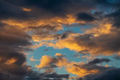 Dramatic clouds rising of sun floating in blue sky to change summer weather Stock Photos