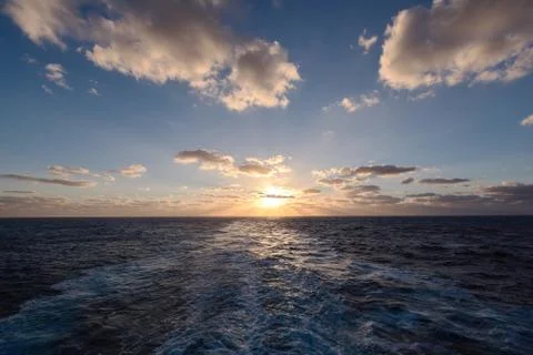 Dramatic clouds sea sunset with sunrays Stock Photos