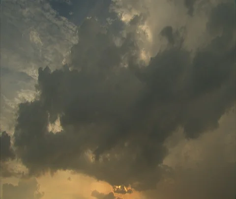 Dramatic clouds in sky, LS of plane flying overhead Stock Footage 86747331