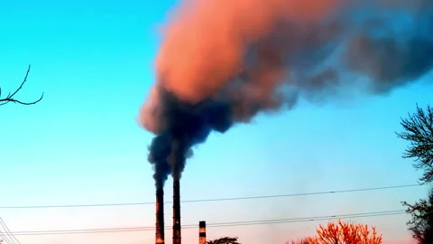 Dramatic clouds in the sky seen from tall chimney pipes with gray dirty smoke Stock Footage 151830264