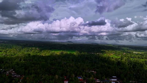 Dramatic clouds skyline over Ubud Bali island Indonesia aerial drone Southeast Stock Footage 329459681