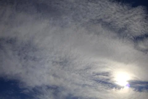 Dramatic Clouds with Sun Rays Filtering Through Stock Photos