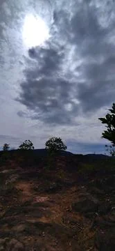 Dramatic clouds with sun rays over landscape terrain 스톡 사진