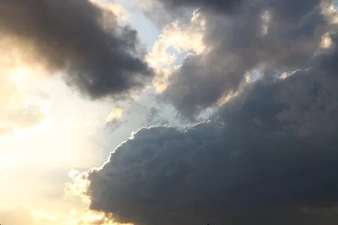 Dramatic clouds with sunlight breaking through Stock Photos
