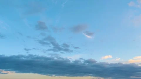 Dramatic Clouds at Sunset with Golden Sunlight and Blue Sky Background Stock Footage 334818207