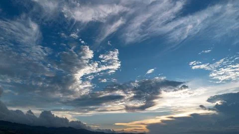 Dramatic Clouds at Sunset Over Mountains Stock Photos