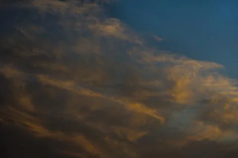 Dramatic clouds at the sunset Stock Photos