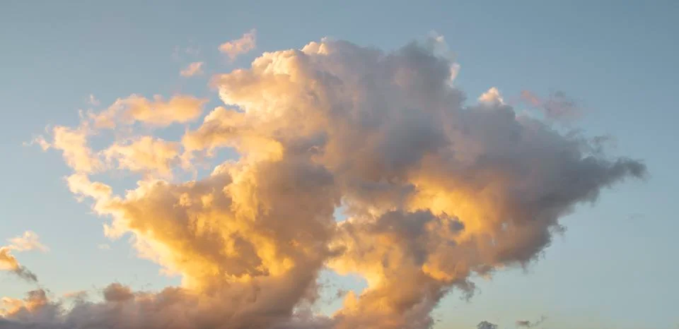Dramatic clouds on sunset sky Stock Photos