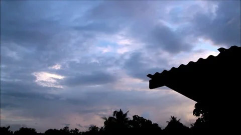 DRAMATIC CLOUDS TIMELAPSE OVER THE ROOF SILHOUETTE Video stock 91221314