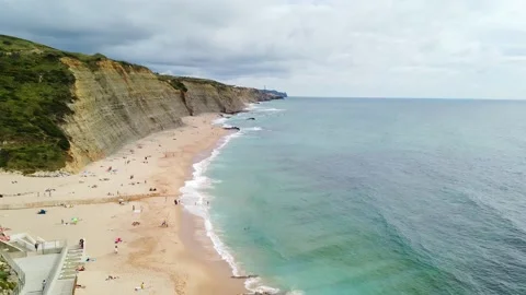 Dramatic clouds, waves splashes in the beach seaside Stock Footage 132528607