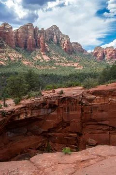 Dramatic cloudscape and sinkhole at Devil's Kitchen in Arizona Stock Photos