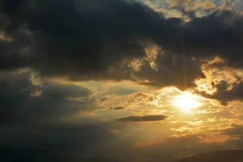 Dramatic cloudscape and sun Stock Photos