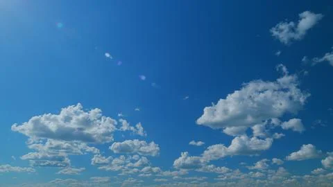 Dramatic cloudscape background. Nature weather blue sky. Time lapse. Stock Photos