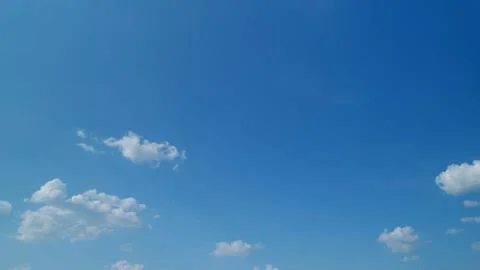 Dramatic cloudscape background. Nature weather blue sky. Timelapse. Stock Photos