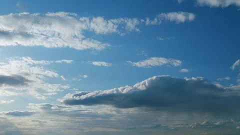 Dramatic cloudscape background. Nature weather blue sky. Timelapse. Stock Photos