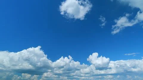Dramatic cloudscape background. Nature weather blue sky. Time lapse. Stock Photos