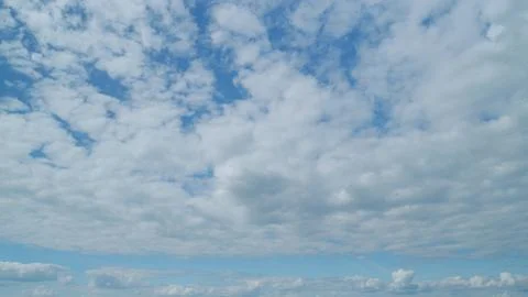 Dramatic cloudscape background. Nature weather blue sky. Time lapse. Stock Photos