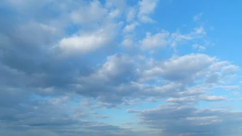 Dramatic cloudscape background. Nature weather blue sky. Timelapse. Stock Photos
