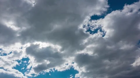 Dramatic Cloudscape: Blue Sky, Cumulus Clouds, and Sunlight Stock-Footage 309545492
