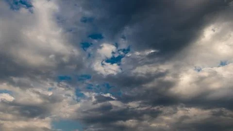 Dramatic cloudscape with blue sky peeking through stormy clouds Foto stock