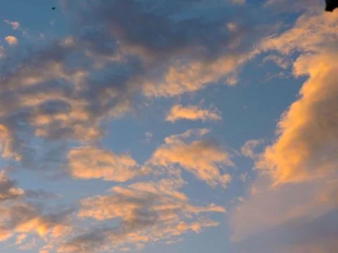 Dramatic cloudscape during the golden hour, likely sunset or sunrise Stock-Fotos