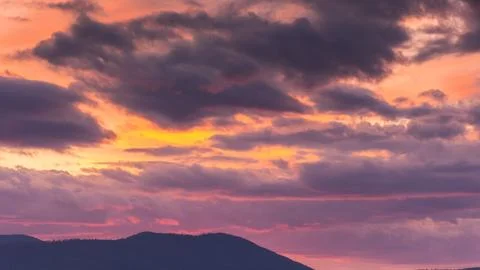 Dramatic cloudscape at dusk. sky in colorful evening light Stock Photos