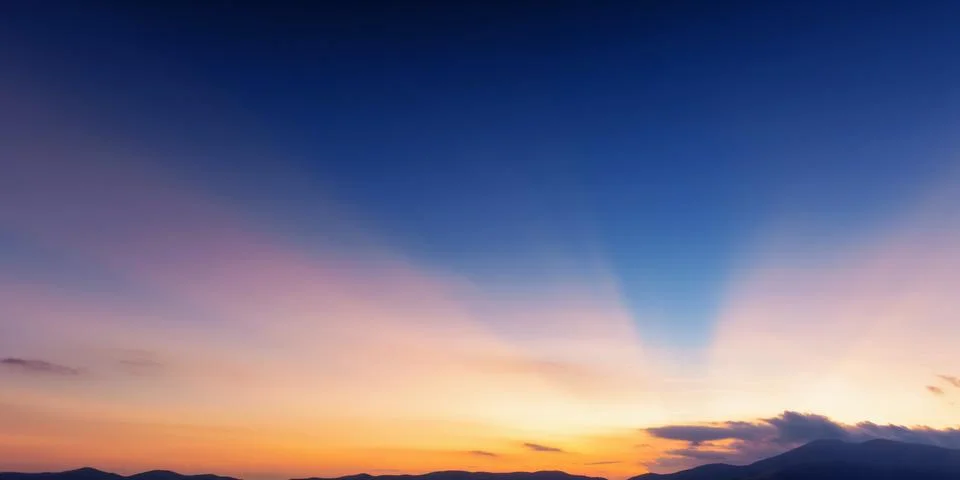 Dramatic cloudscape at dusk. sky in colorful evening light Stock Photos