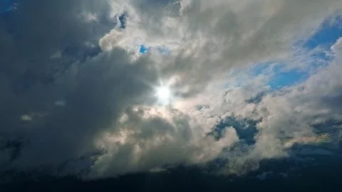 Dramatic Cloudscape Featuring Radiant Sunlight Beautifully Breaking Through the Stock Footage 318146957