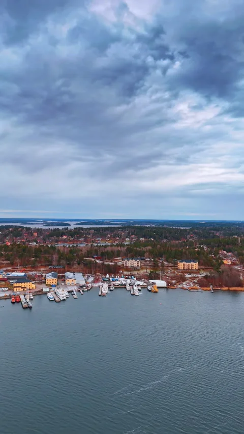 Dramatic cloudscape gathered in the sky over the cityscape. Aerial perspective Stock Footage 328319376